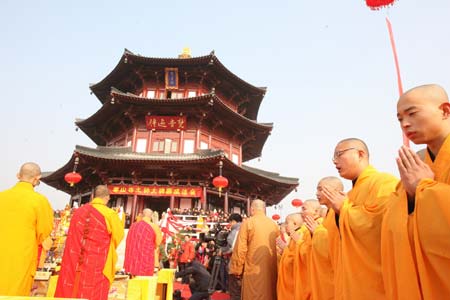 Monks attend the completion ceremony of the Giant Bell and Stele Garden at the Hanshan Temple in Suzhou, east China's Jiangsu Province, Dec. 30, 2008. The Giant Bell and Stele Garden at the Hanshan Temple was opened to tourists on Tuesday for the occasion of the New Year toll at the temple on Wednesday.