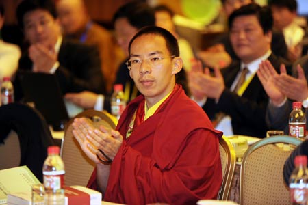 The 11th Panchen Lama, Bainqen Erdini Qoigyijabu, attends a sub-forum of the Second World Buddhist Forum (WBF) in Wuxi, east China's Jiangsu Province, on March 29, 2009. Bainqen Erdini Qoigyijabu, attended the forum Sunday here with businessmen and monks, where they discussed Buddhist philosophies related to business. (Xinhua/Han Yuqing)