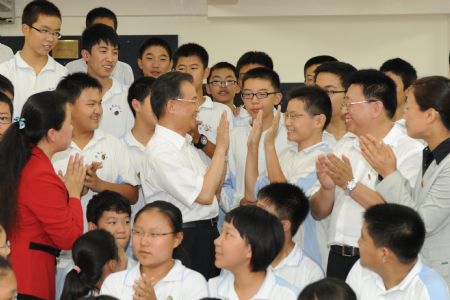 Paying tribute to teachers, premier sits in on classes